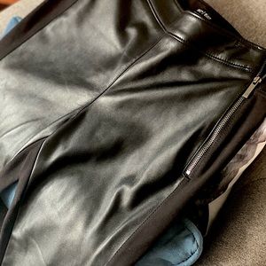 Black skinny jeggings with faux leather detailing